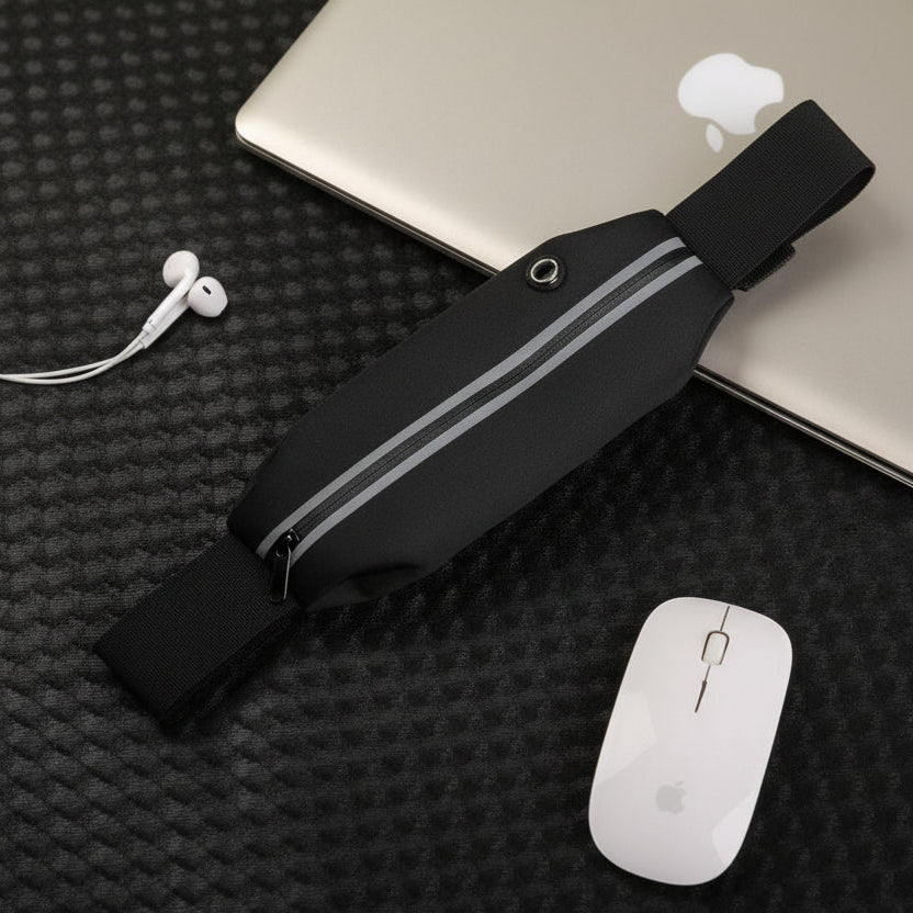 Black waist bag with gray stripes on a black textured surface with a laptop and mouse.