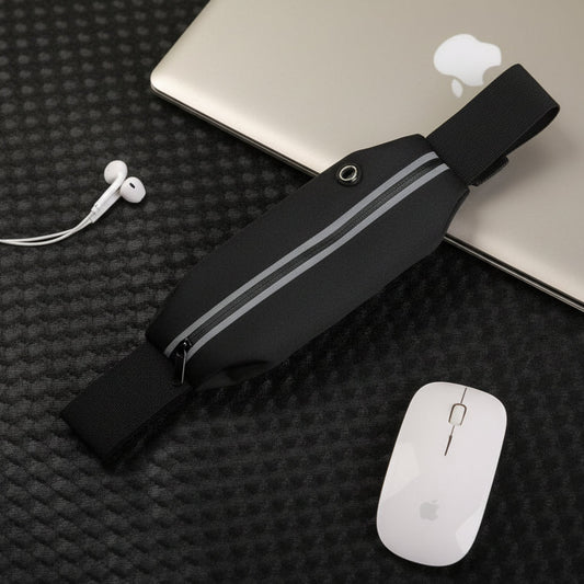 Black waist bag with gray stripes on a black textured surface with a laptop and mouse.