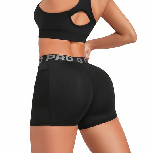 Black athletic shorts with a visible brand logo on a white background