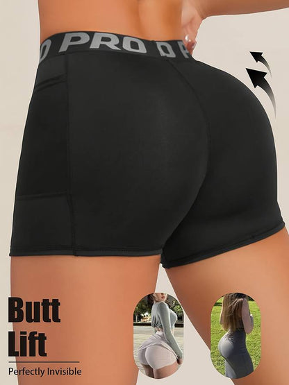 Black athletic shorts with a brand logo on a beige background