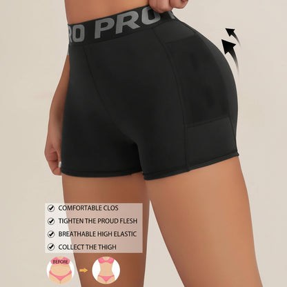 Black compression shorts with a visible brand logo on a beige background